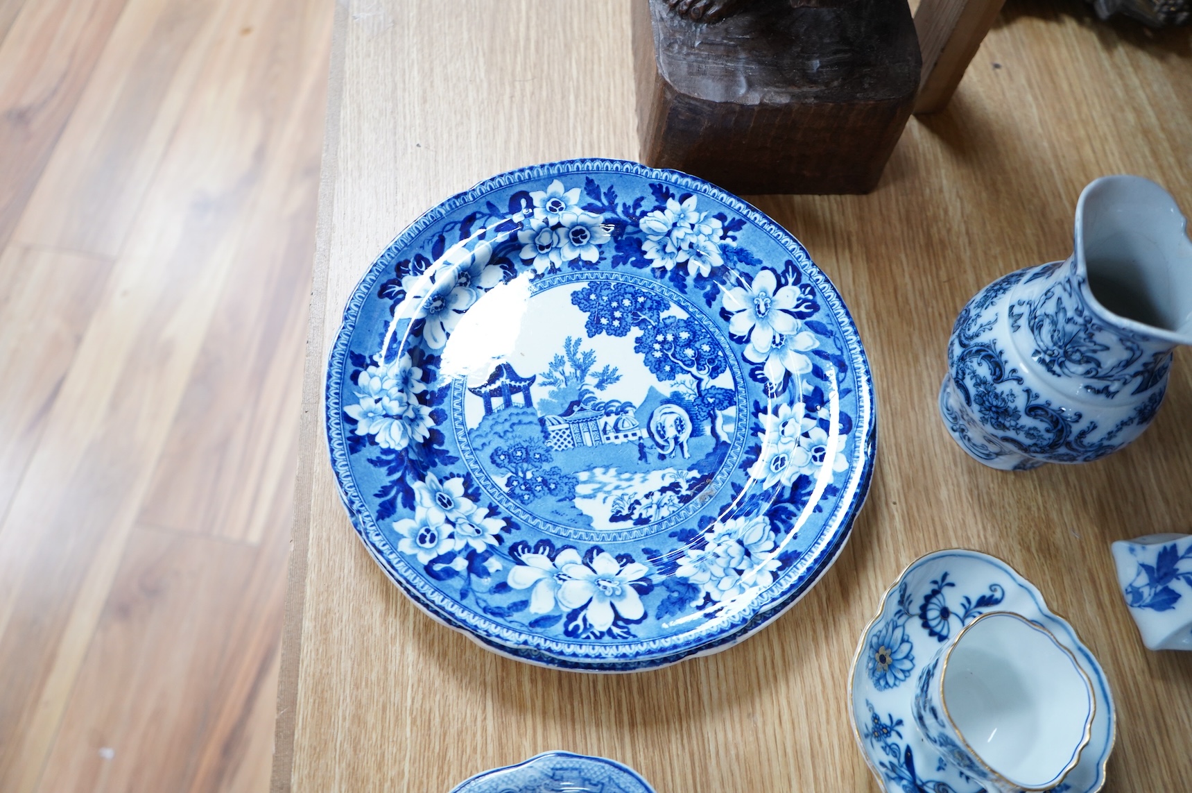 A group of blue and white Willow pattern china, 19th century and later and a Meissen cup and. Saucer. (12).
